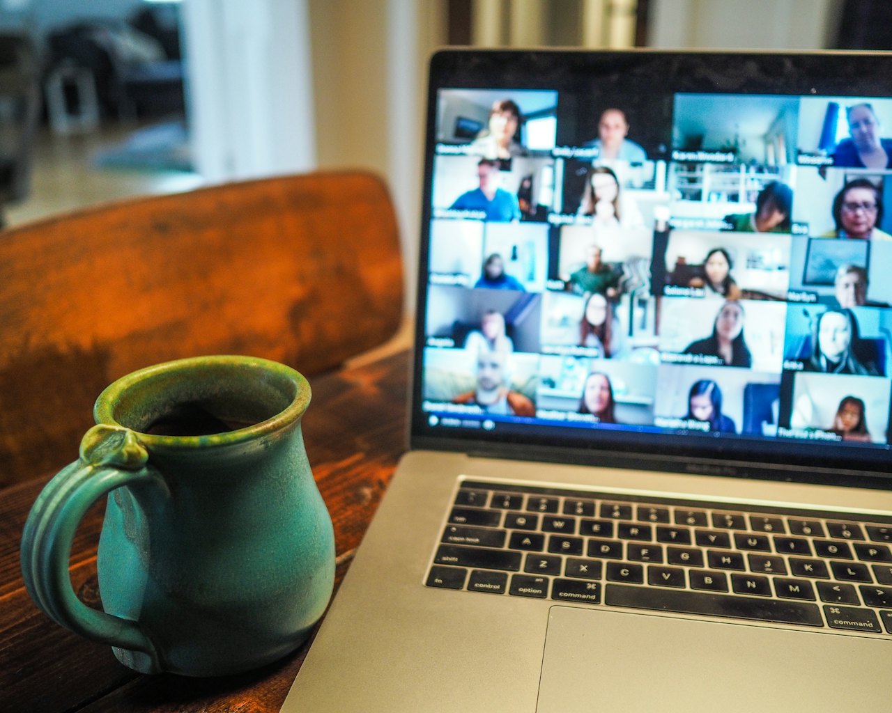 Laptop showing a live video class with many participants
