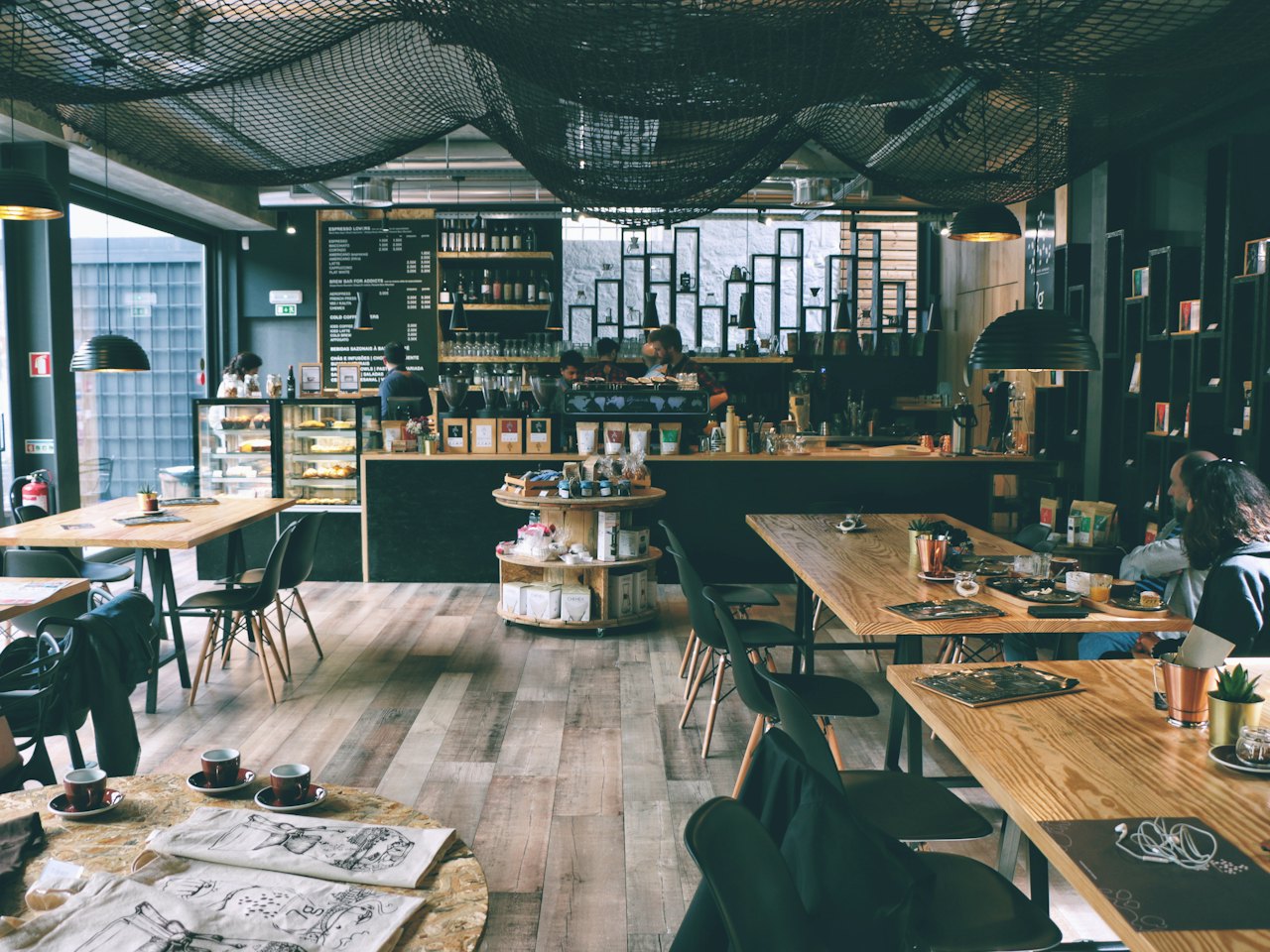 Open-plan study space with long wooden tables